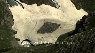 Lidder river flows under snow tongues at Zojibal : Kashmir