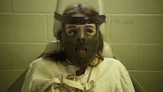 Restrained girl in prison psych ward