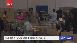 Community members help build holiday food boxes at Coastal Bend Food Bank