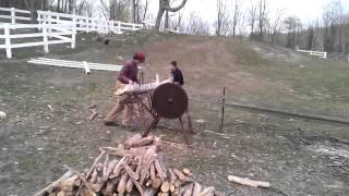 The boys using Buzz Saw and 1930s tractor