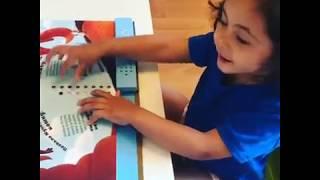 Петра записывает сказку в книгу-диктофон VoiceBook