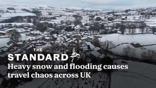 UK weather: the most striking footage as snow and flooding causes transport chaos