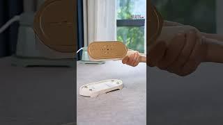 Effortlessly smooth your clothes with our portable mini garment steamer!