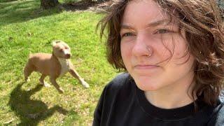 white boy touches grass (suburban lawn)