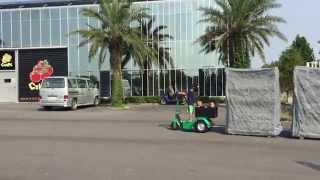 Electric Trike by little boy in Taiwan pulling cc containers