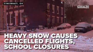 SNOW UPDATE: Heavy snowfall continues causing delays, flight cancellations, school closures