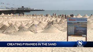 Father-son duo build hundreds of pyramids on a Santa Cruz beach