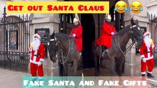 Santa Claus is so rude. He broke the rules twice and of course the guard warned him.