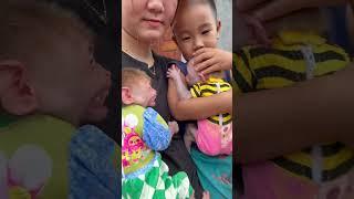 mother holding babies
