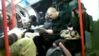 Crazy Dude talking to himself on the central line tube, london.