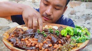 eating mithun skin and kidney beans, bitter egg plant, litsea ccubeba, chayote leaves, king chilly.