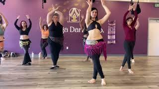 Body waves and arm waves in fusion belly dance