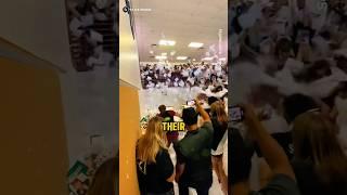Why Are These Students Throwing All Their Notebooks In The Air?