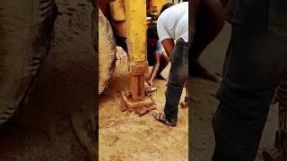 removing stabilizer foot pin at site. #jcb3dx #jcbvideo #jcb