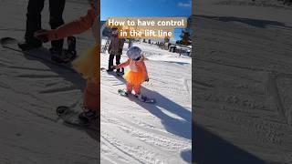 Teaching our 5 year old how to control her snowboard in a lift line