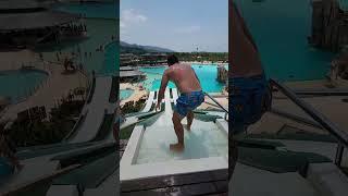 Man does an incredible dive from the water slide!