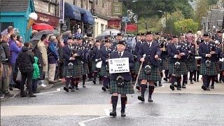 Vale of Atholl & Northern Constabulary Pipe Bands in street parade to 2024 Pitlochry Highland Games