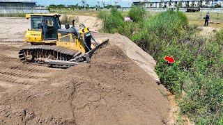 Great project Bulldozer and Loader pushing sand filling land with dump trucks