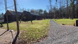 AutoCamp Reviews: AutoCamp Catskills Clubhouse, Fire Pit, and Lawn.