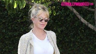 Melanie Griffith Stuns In Chic Cardigan & Ripped Denim While Shopping At Fred Segal 4.10.17