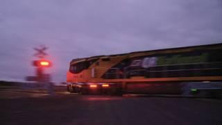 QRNational (Aurizon) Freight Train at Level Crossing (18/1/2011) - PoathTV Australian Railways