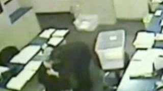 Gunman prays with bank clerk , exchange hugs , then robs her
