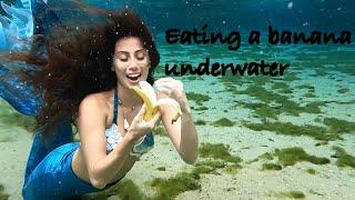 Eating a banana underwater