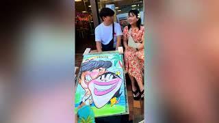 Couple from Korea gets caricature in Hawaii!