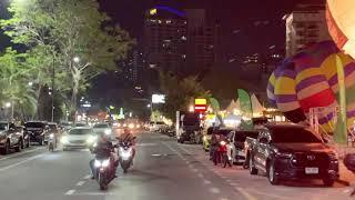 Songteo Taxi riding along Beach Road in the evening, Pattaya, Thailand, 21.04.2024