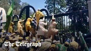 Imran Khan: protesters scale Supreme Court gate after former Prime Minister granted bail