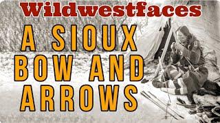 A Sioux Bow And Arrows