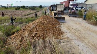 Wonderful Activity Use KOMATSU D31P Bulldozer & Dump Trucks filling Flooded land Next to the road