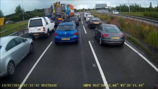 Truck driver gets out on the motorway in live traffic