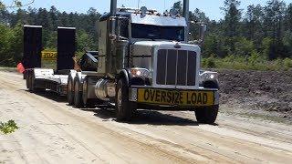 EXCAVATOR John Deere 250G LC loading PETERBILT Truck Florida