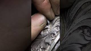 Hand engraving on a buckle.