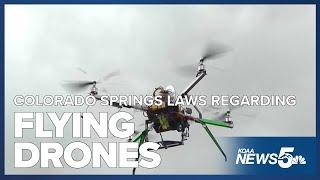 Do Colorado Springs laws permit the flying of drones above private property?