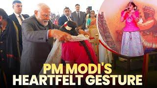 PM Modi gifts his shawl to a Girl during Pongal celebrations