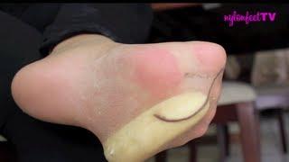 Nylon Feet smashing a banana