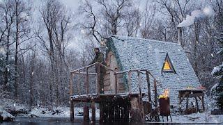 Log cabin on the riverbank in a snowstorm. ASMR