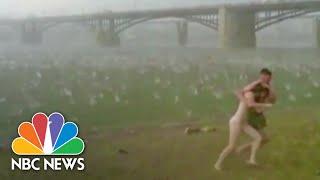 Violent Hailstorm Sends Sunbathers Running | NBC News