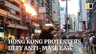 Hong Kong protesters defy anti-mask law