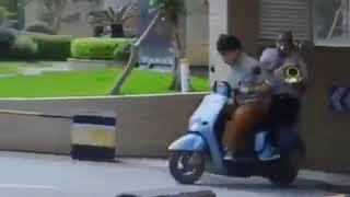 Man Playing Trombone on Motorbike