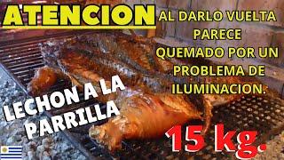 LECHON ENTERO A LA PARRILLA. "CONTIENE UNA PARTE MAL ILUMINADA" AL DARLO VUELTA.
