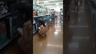 #walmart woman not paying attention to her kids. one in the shopping cart and one wondering  around