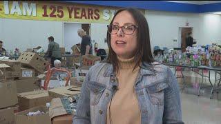 Volunteers in Cobb County coming together to sort, pack food for hundreds of families