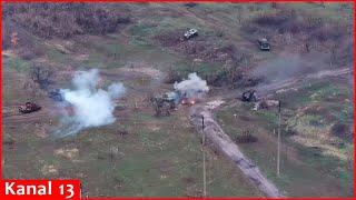 Ukrainian fighters hiding in a forest lane ambushed a convoy of Russian military equipment