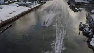 Weirs Winter Barefoot run behind snowmobile