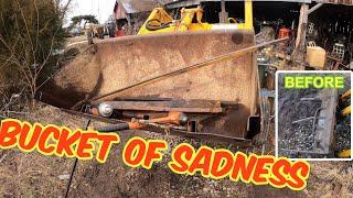 BUCKET OF SADNESS: John Deere 1020 loader gets attention