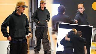 Justin Bieber looks casual in track bottoms a hoodie as arrived to the parking garage with his pals