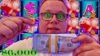 Thousands Of Dollars Into A Piggy Bank Slot